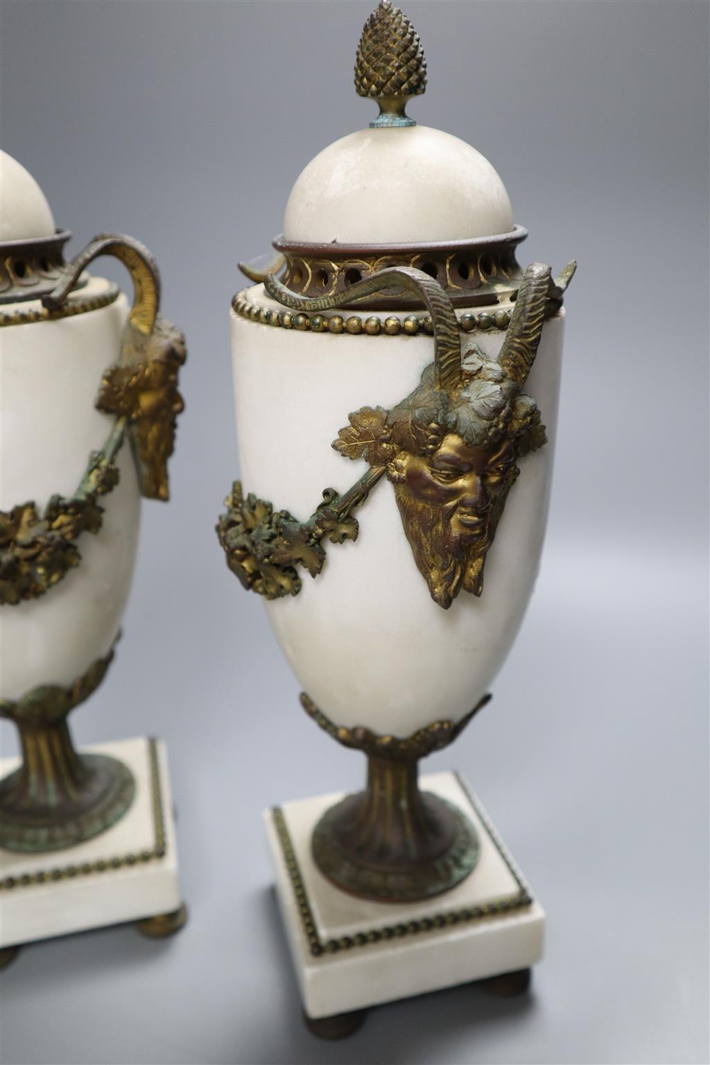 A pair of white marble and ormolu-mounted urns, in neo-classical style, with covers, 31cm